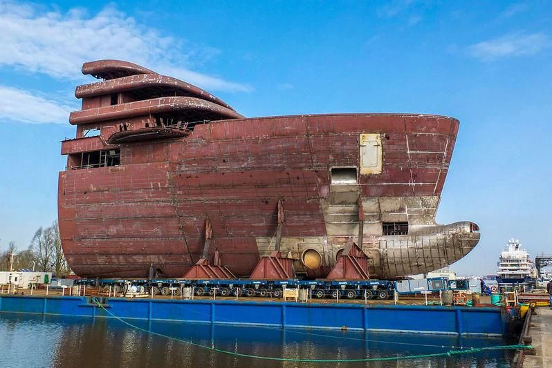 a large building with a water body aboard SOLARIS Yacht for Sale