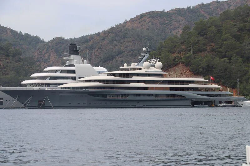 a large cruise ship docked aboard SOLARIS Yacht for Sale