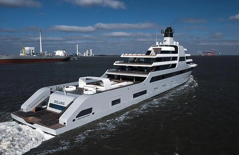 a white yacht on the water aboard SOLARIS Yacht for Sale