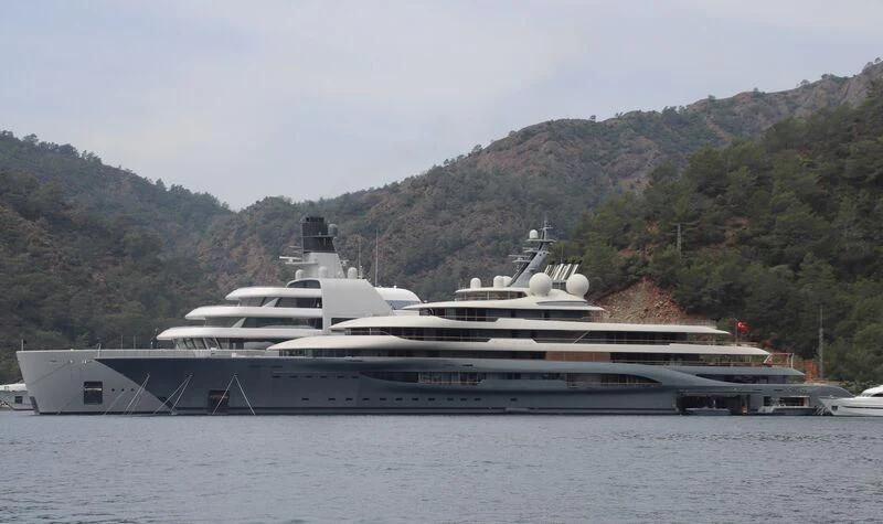 a large cruise ship docked aboard SOLARIS Yacht for Sale