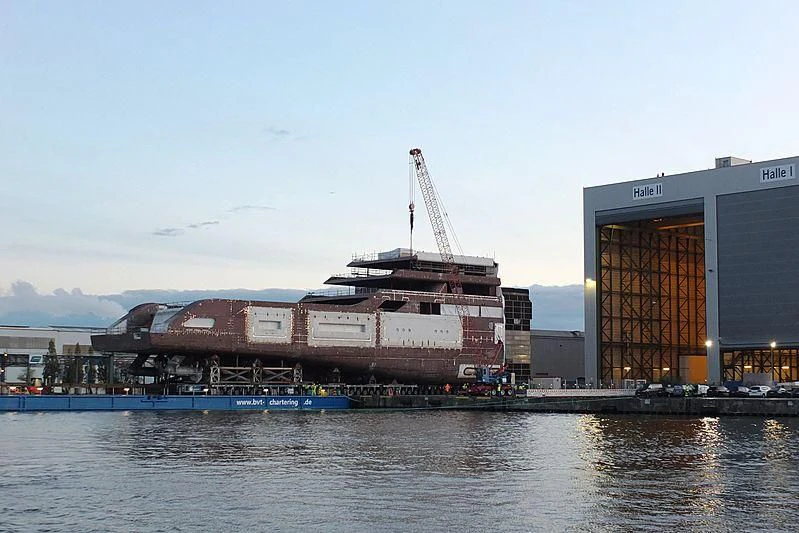 a large ship in a harbor aboard SOLARIS Yacht for Sale