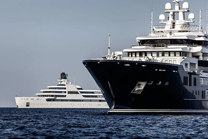a couple of large ships in the water aboard SOLARIS Yacht for Sale