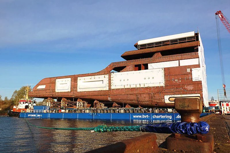 a large building with a sign on it aboard SOLARIS Yacht for Sale