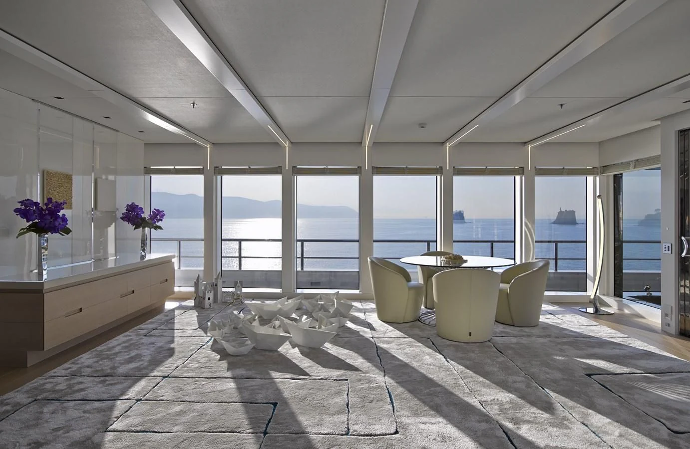 a room with large windows aboard STELLA MARIS Yacht for Sale