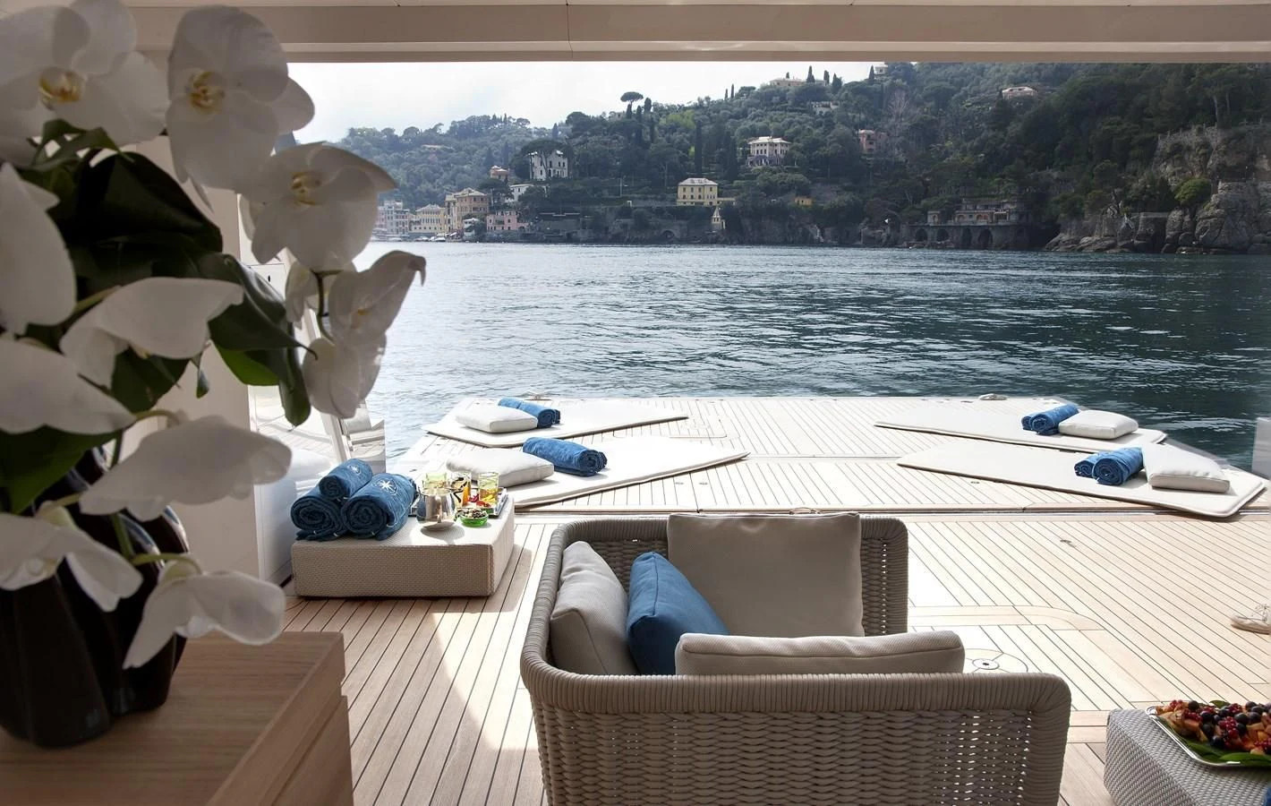 a room with a couch and a table and a chair aboard STELLA MARIS Yacht for Sale