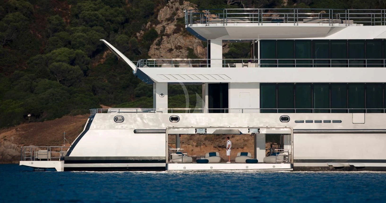 a large white building with a pool aboard STELLA MARIS Yacht for Sale