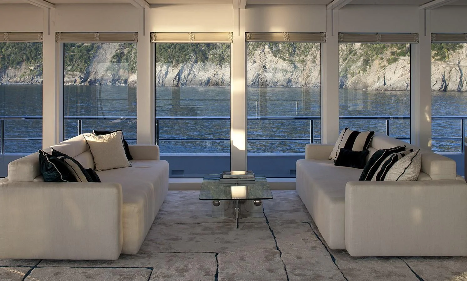 a living room with a large window aboard STELLA MARIS Yacht for Sale