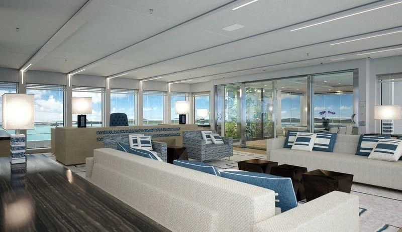 a large room with couches and a tv aboard STELLA MARIS Yacht for Sale