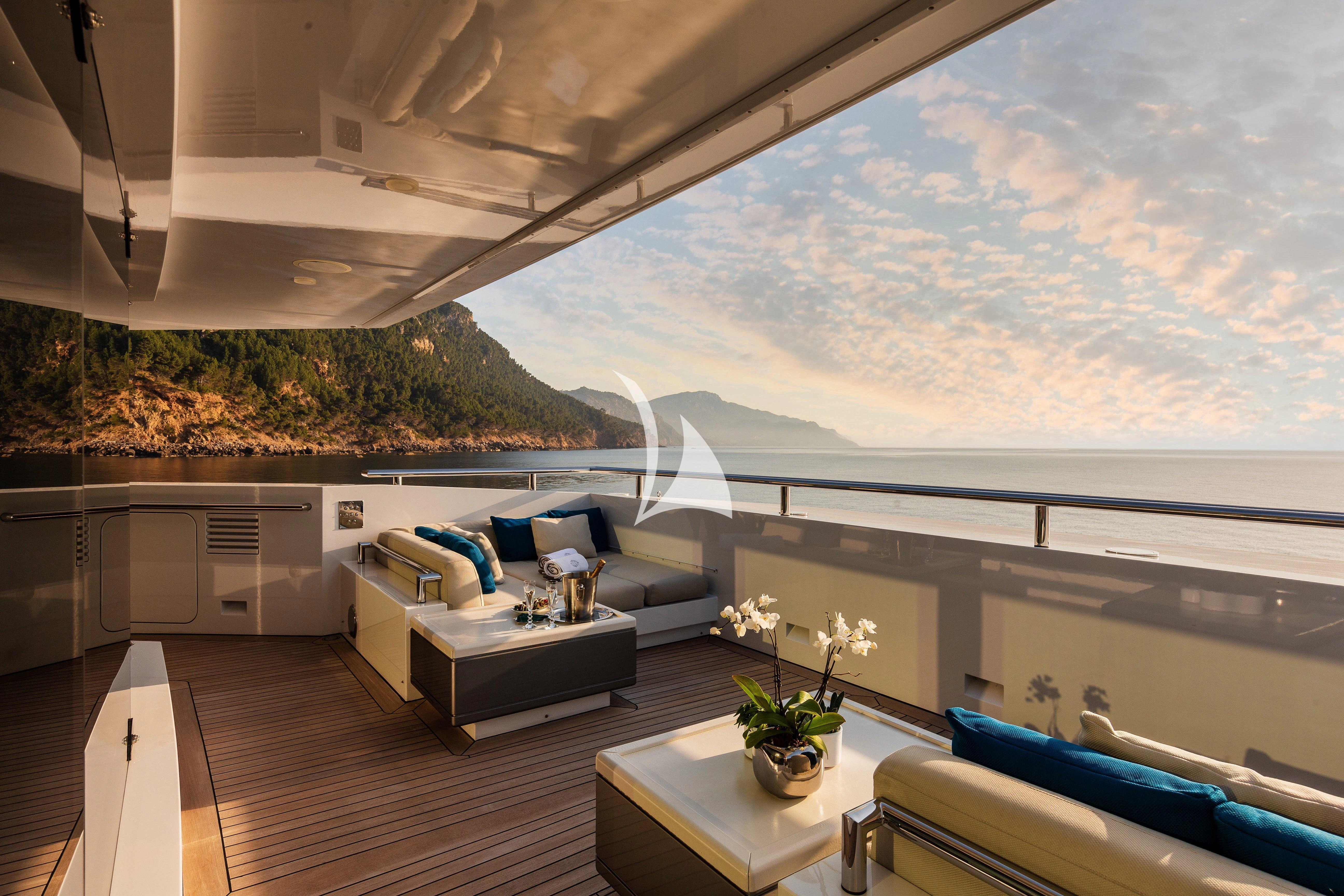 a room with a large balcony overlooking the ocean aboard STELLA MARIS Yacht for Sale