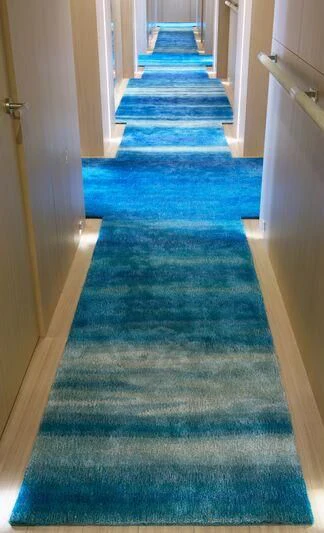a long hallway with a carpet aboard STELLA MARIS Yacht for Sale