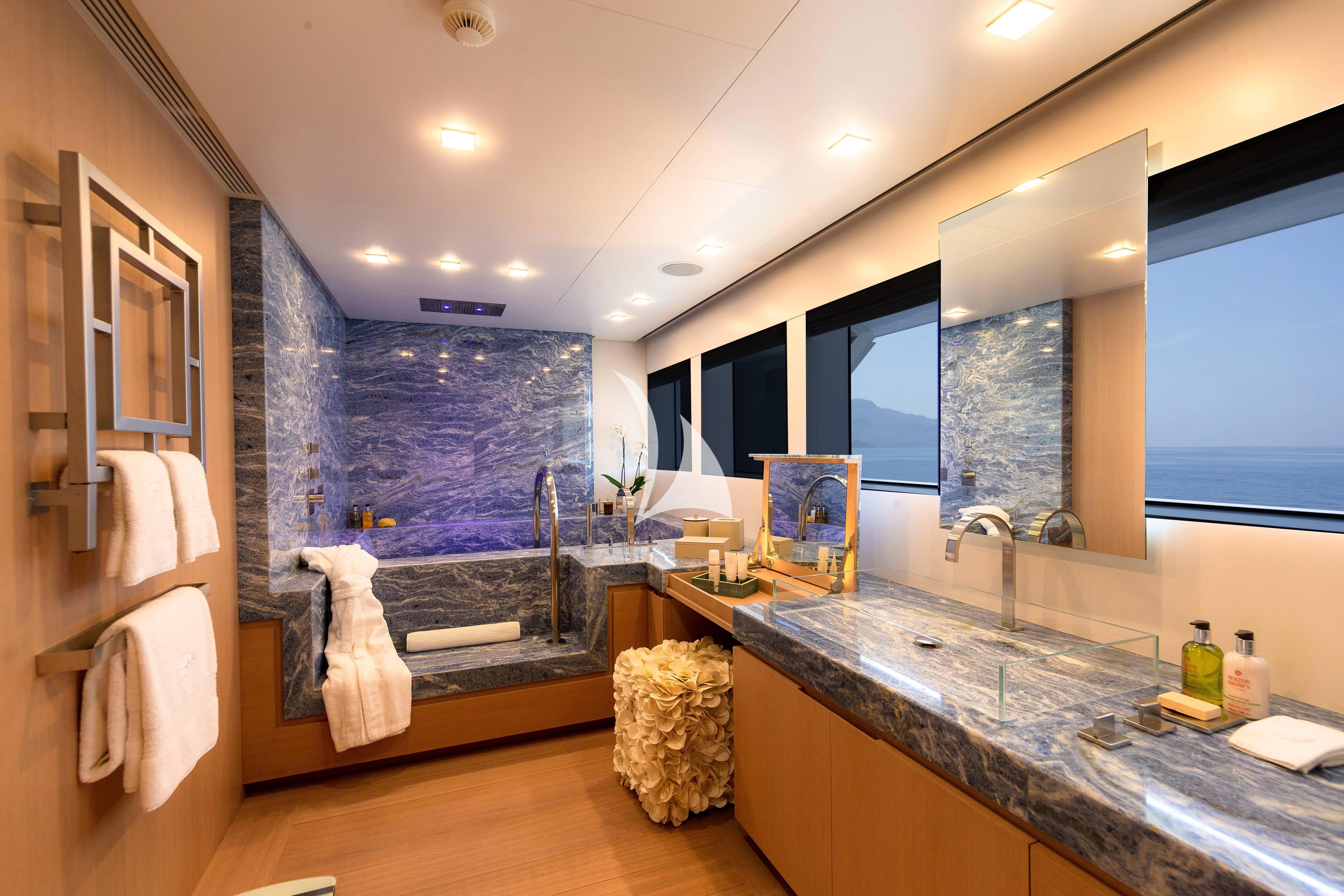 a bathroom with a large mirror aboard STELLA MARIS Yacht for Sale
