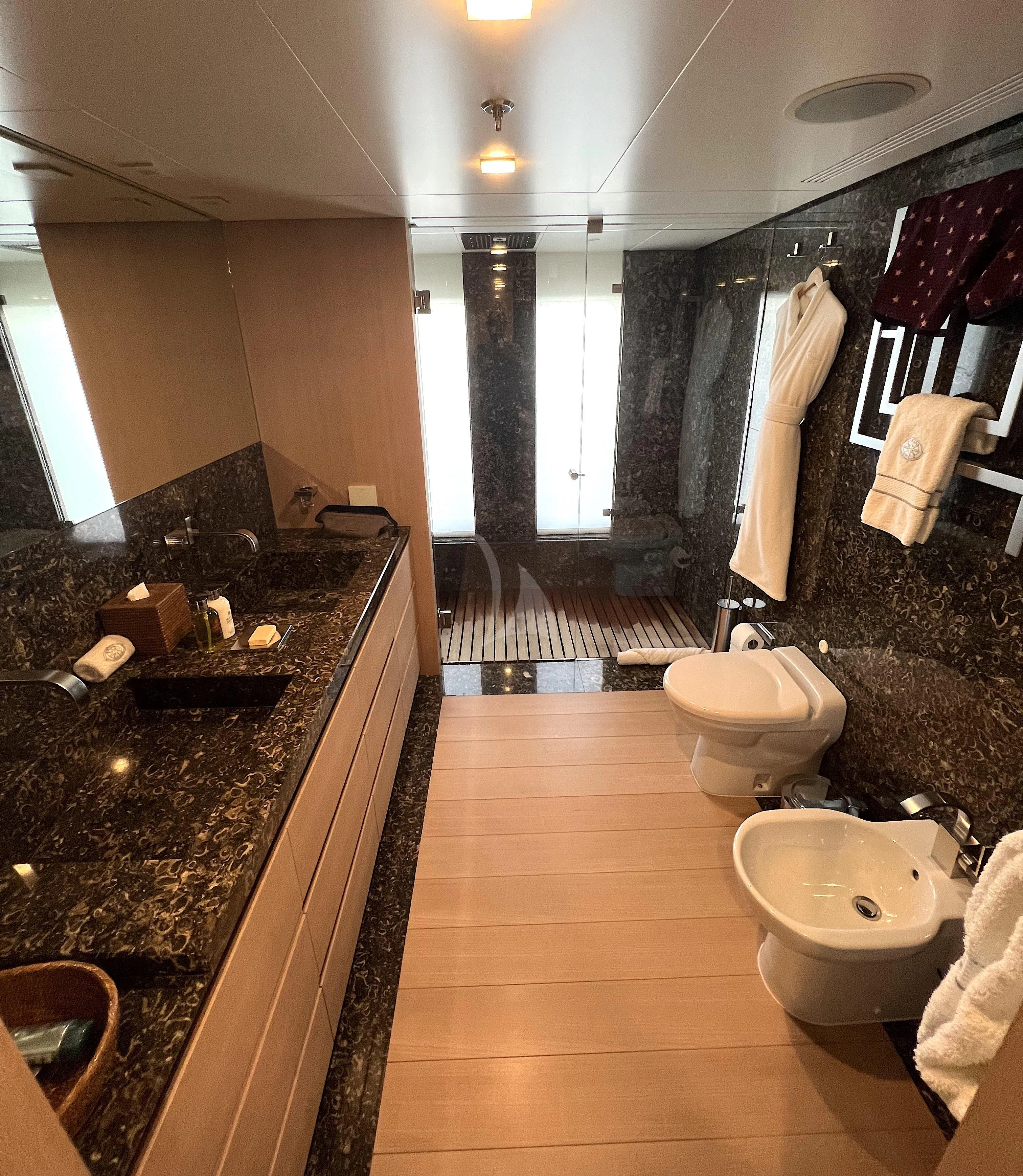a bathroom with a large mirror aboard STELLA MARIS Yacht for Sale