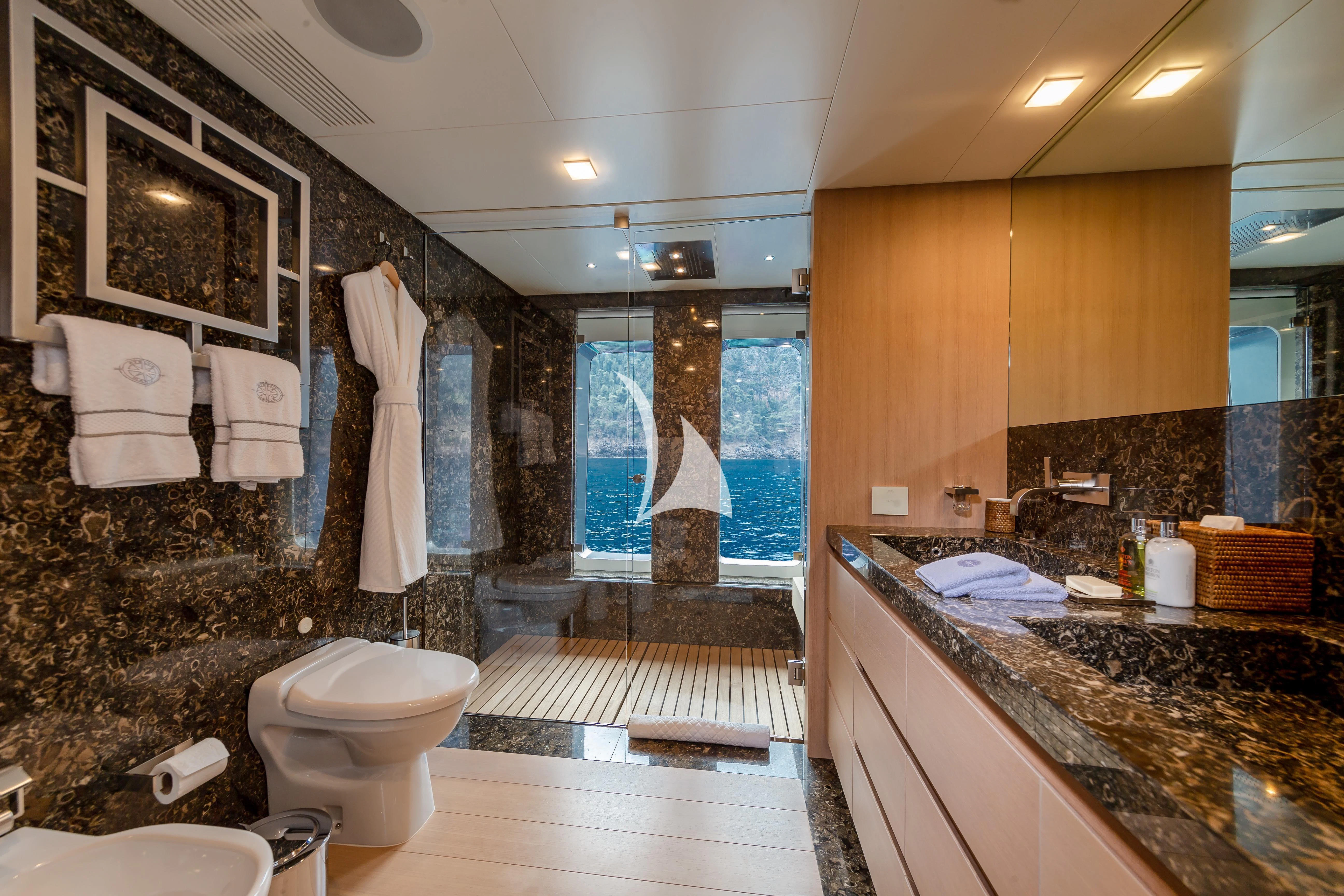 a bathroom with a large mirror aboard STELLA MARIS Yacht for Sale