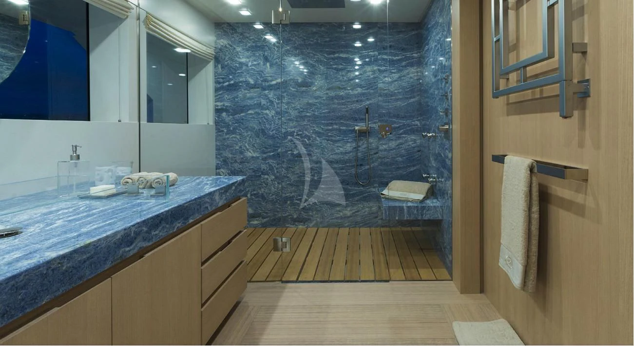 a bathroom with a countertop sink and a shower aboard STELLA MARIS Yacht for Sale