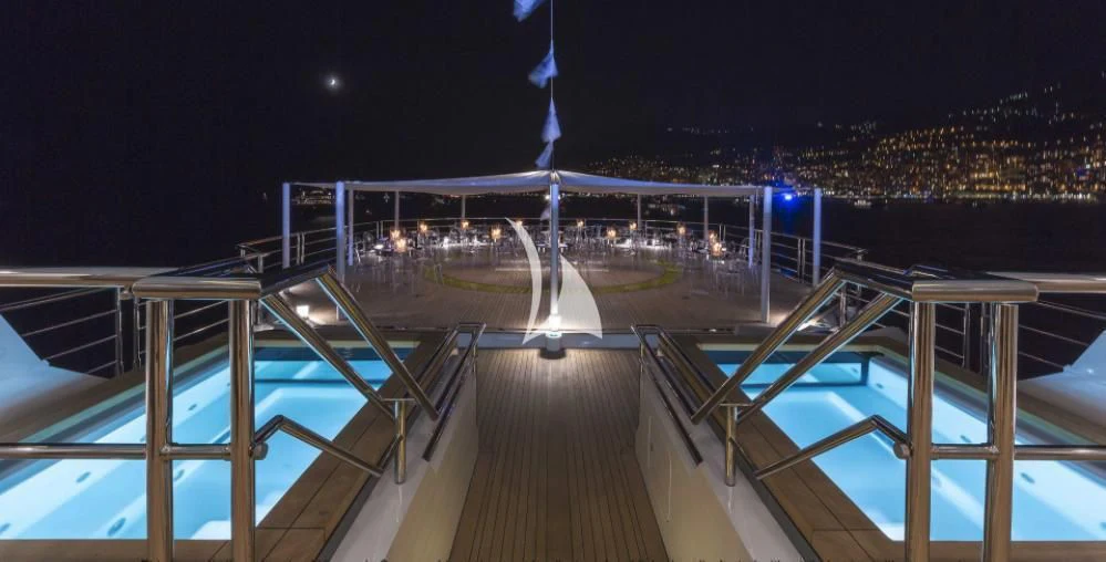 a large bridge over a body of water at night aboard STELLA MARIS Yacht for Sale