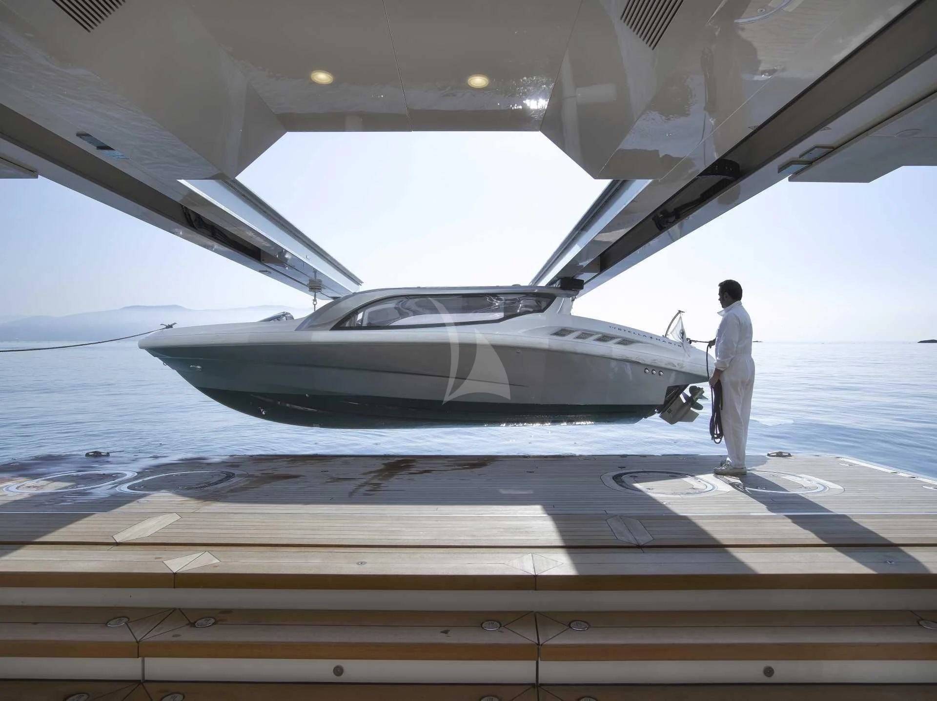 a person standing next to a plane aboard STELLA MARIS Yacht for Sale