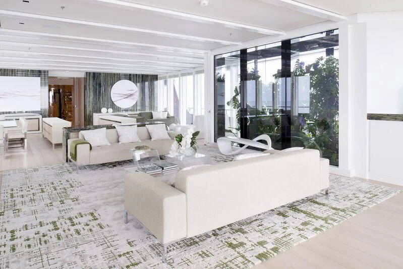 a large living room with a large window aboard STELLA MARIS Yacht for Sale