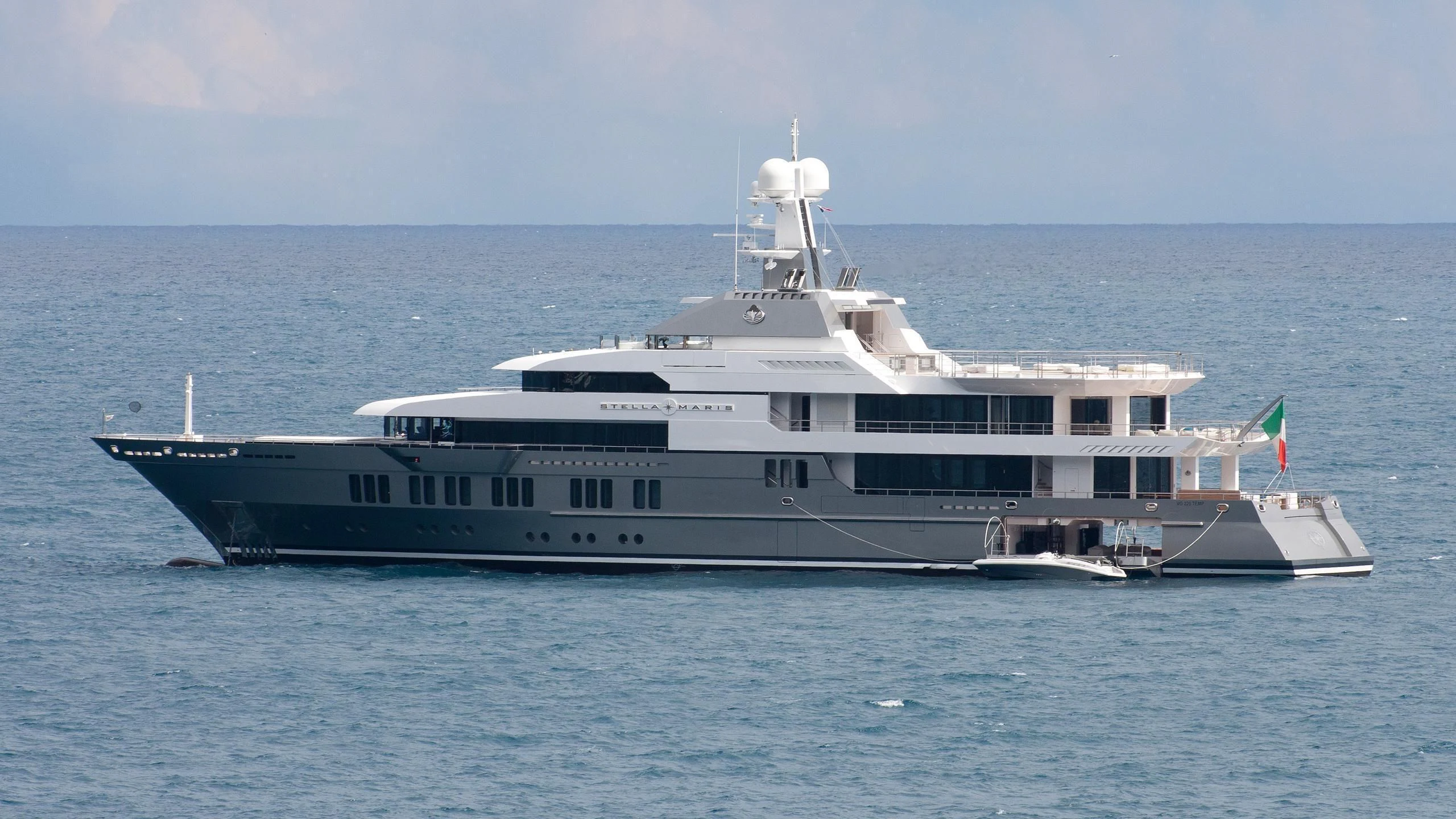 a large ship in the water aboard STELLA MARIS Yacht for Sale