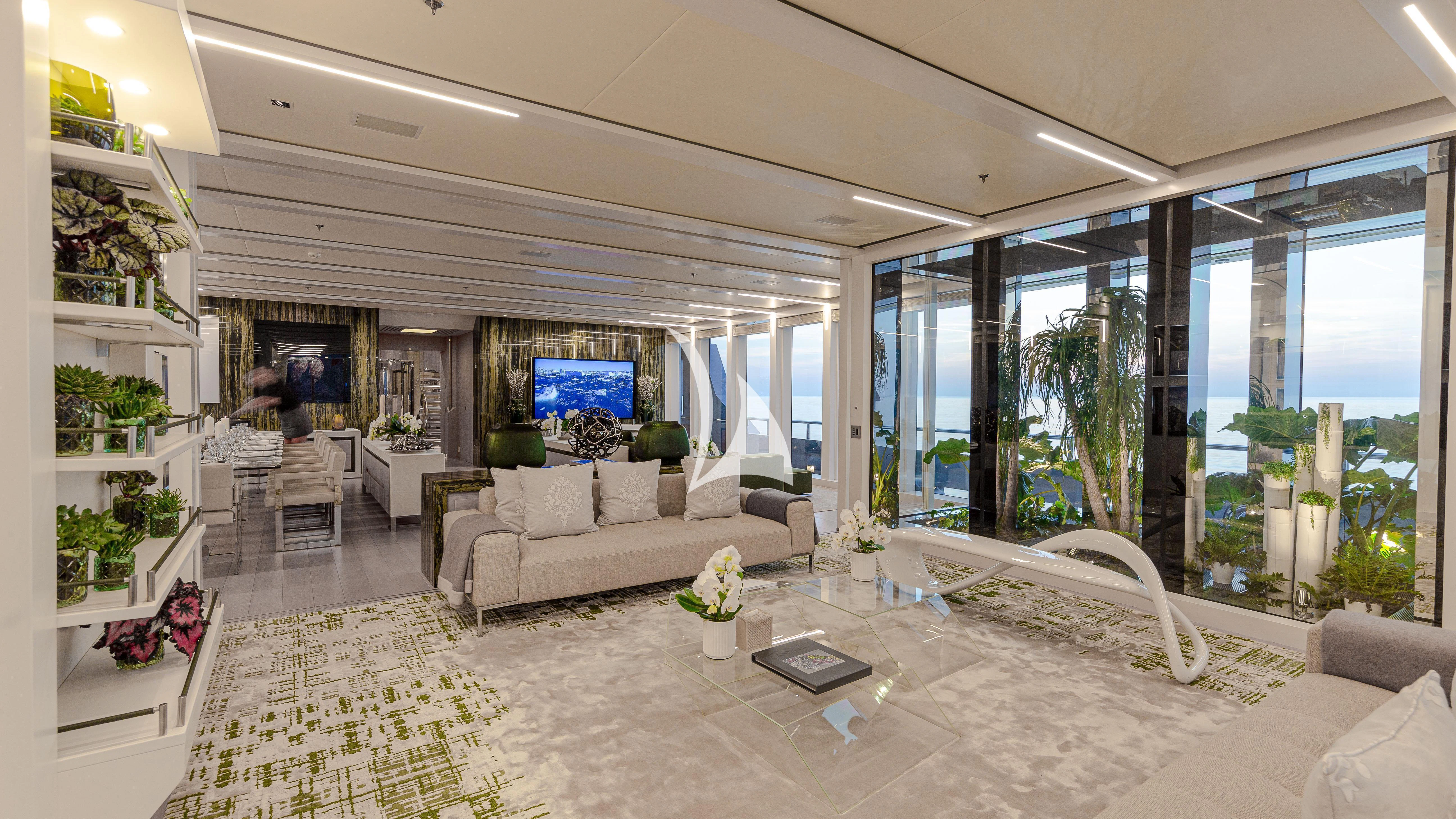 a living room with a large window aboard STELLA MARIS Yacht for Sale