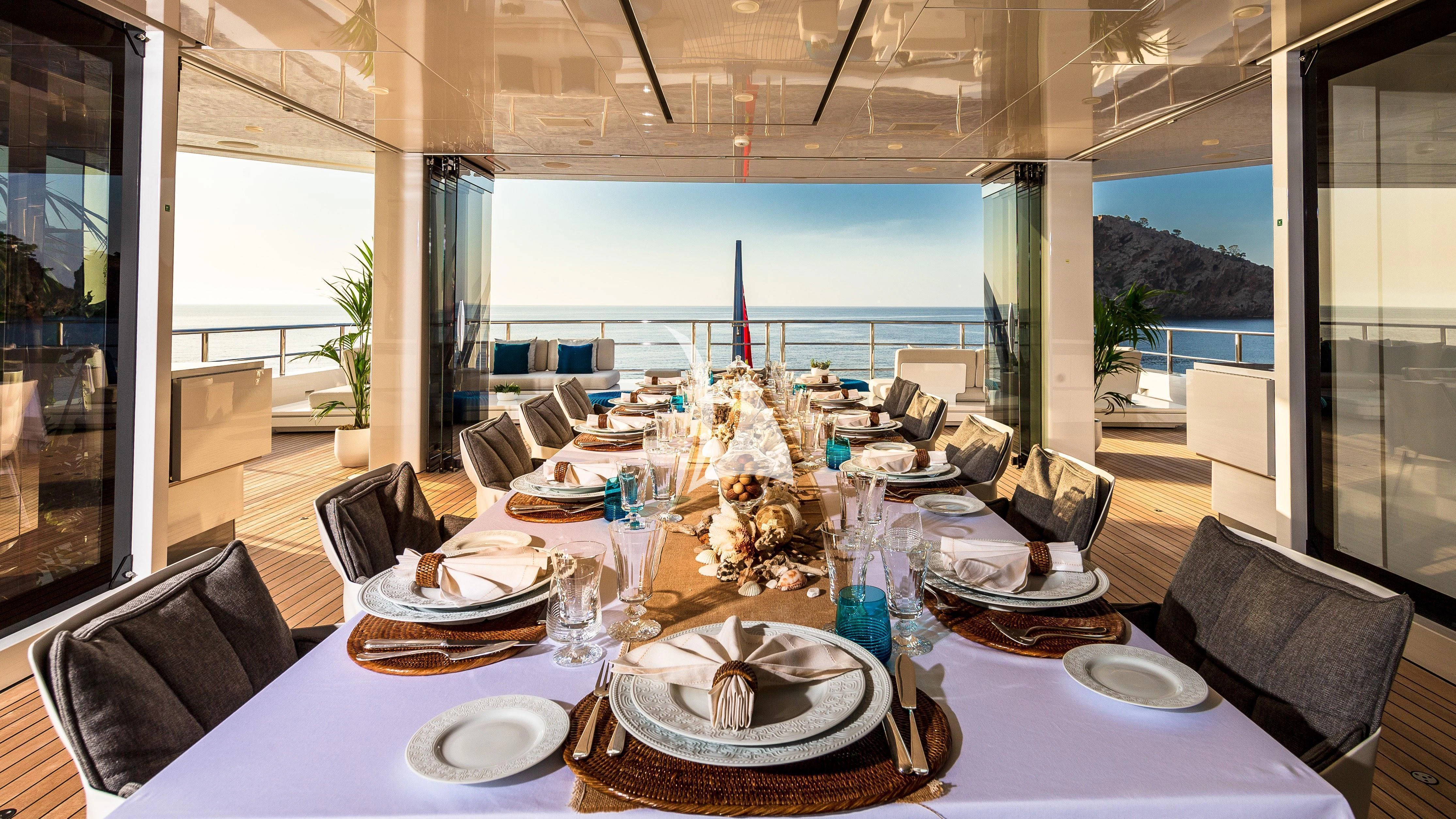 a table set for a dinner aboard STELLA MARIS Yacht for Sale
