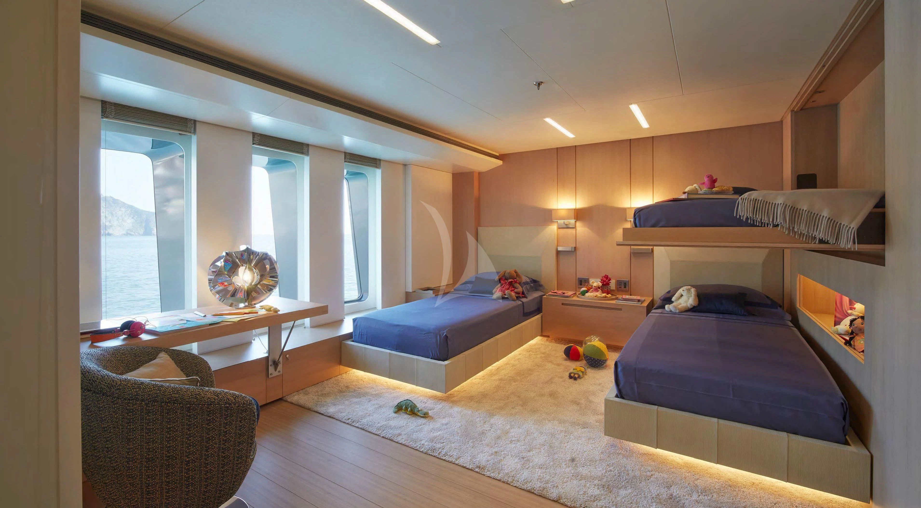 a bedroom with a large window aboard STELLA MARIS Yacht for Sale