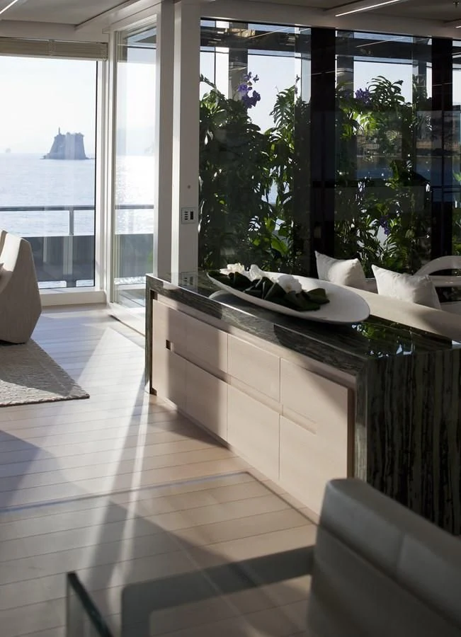 a room with a large window aboard STELLA MARIS Yacht for Sale