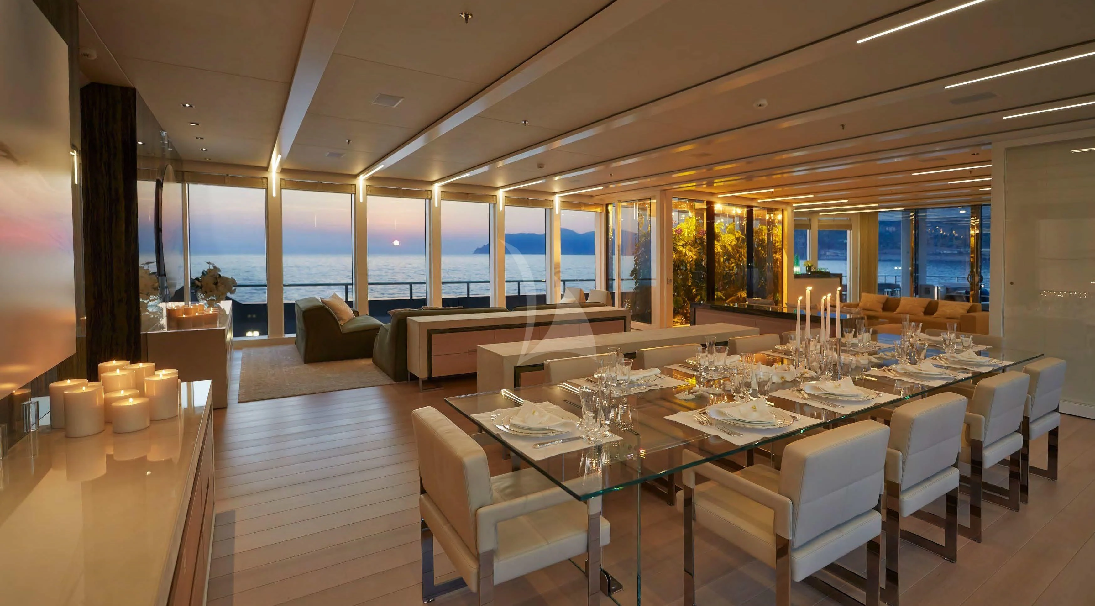 a large dining room with a large table and chairs aboard STELLA MARIS Yacht for Sale