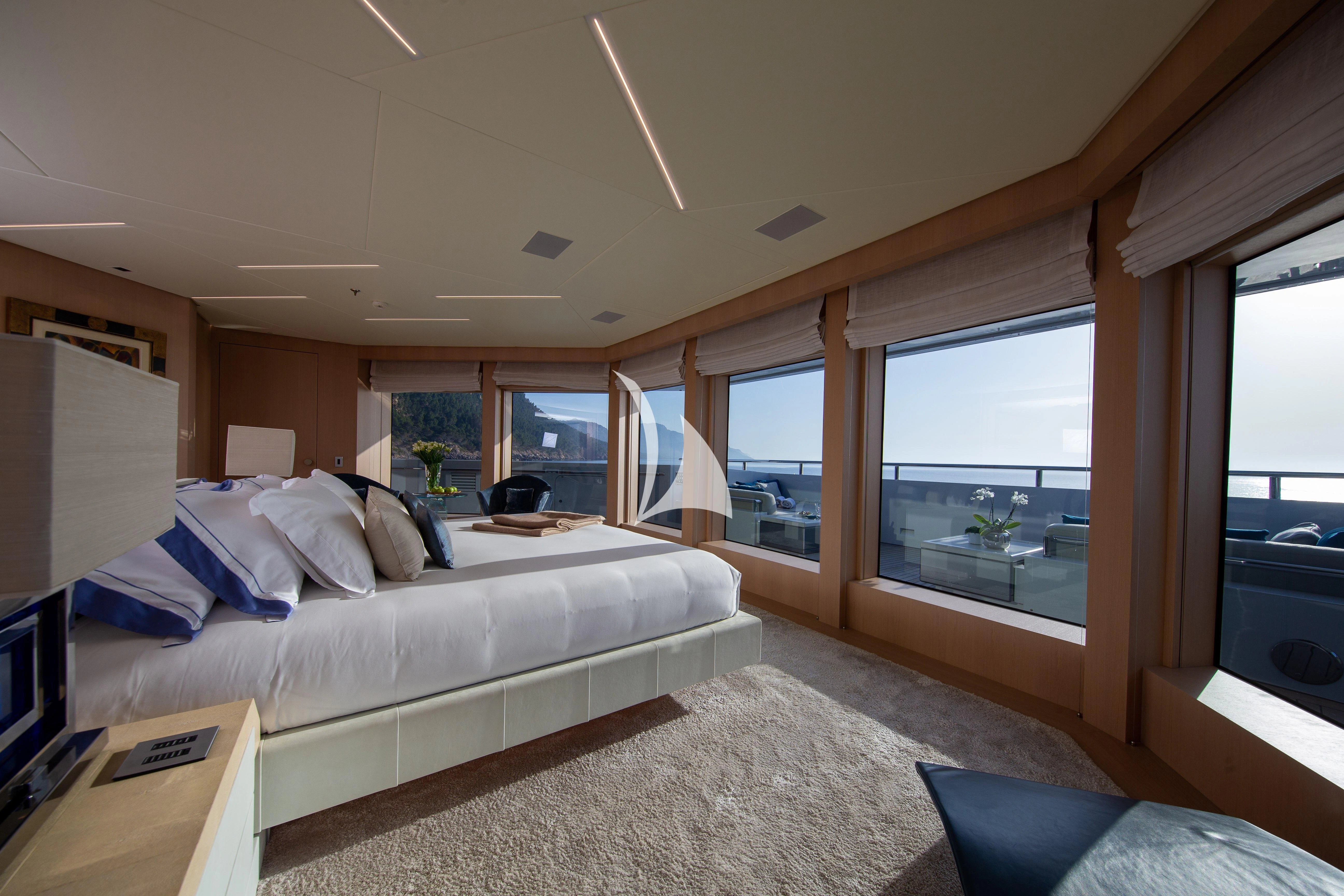 a bedroom with a large bed aboard STELLA MARIS Yacht for Sale