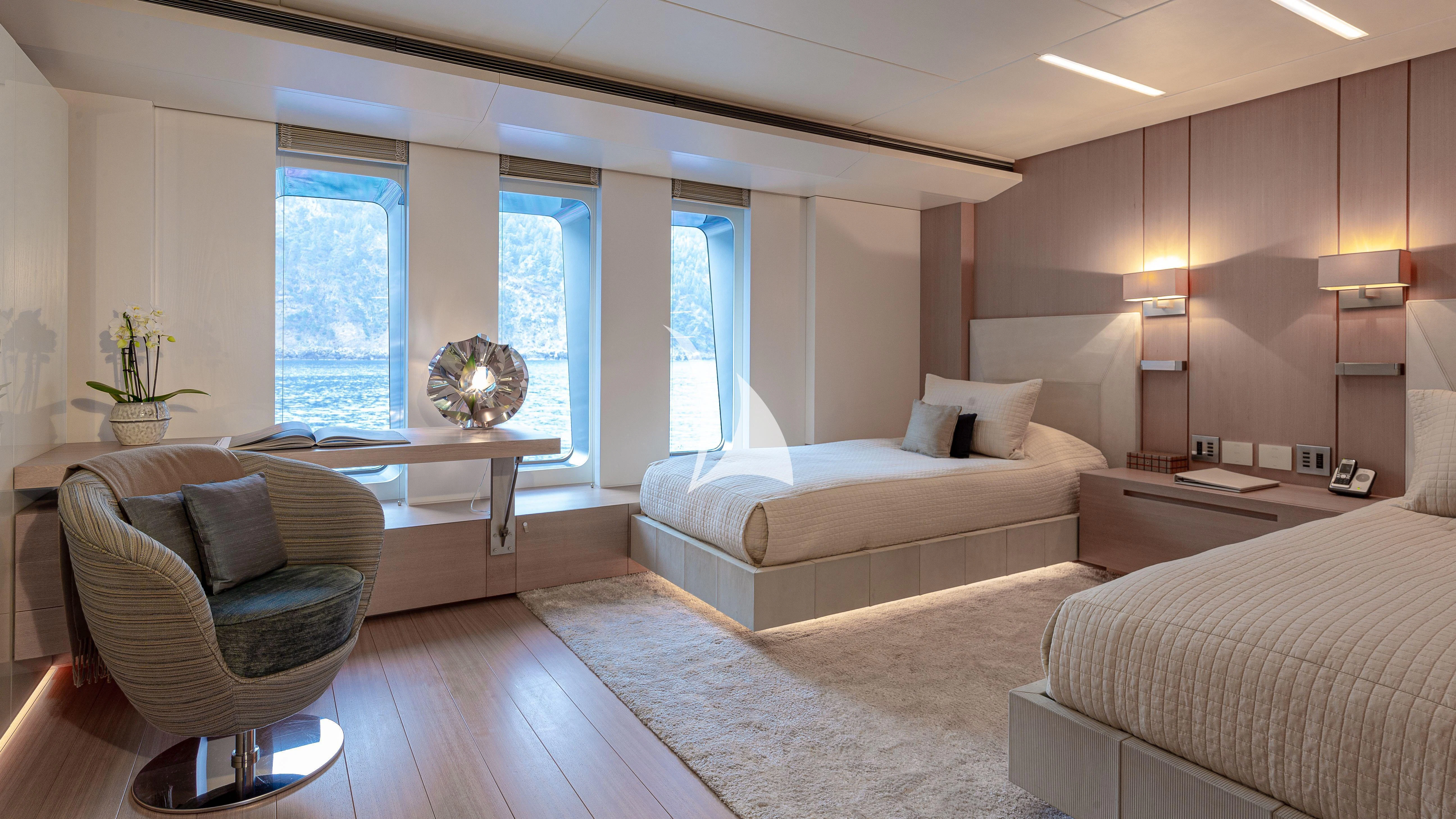 a living room with a couch and a table aboard STELLA MARIS Yacht for Sale