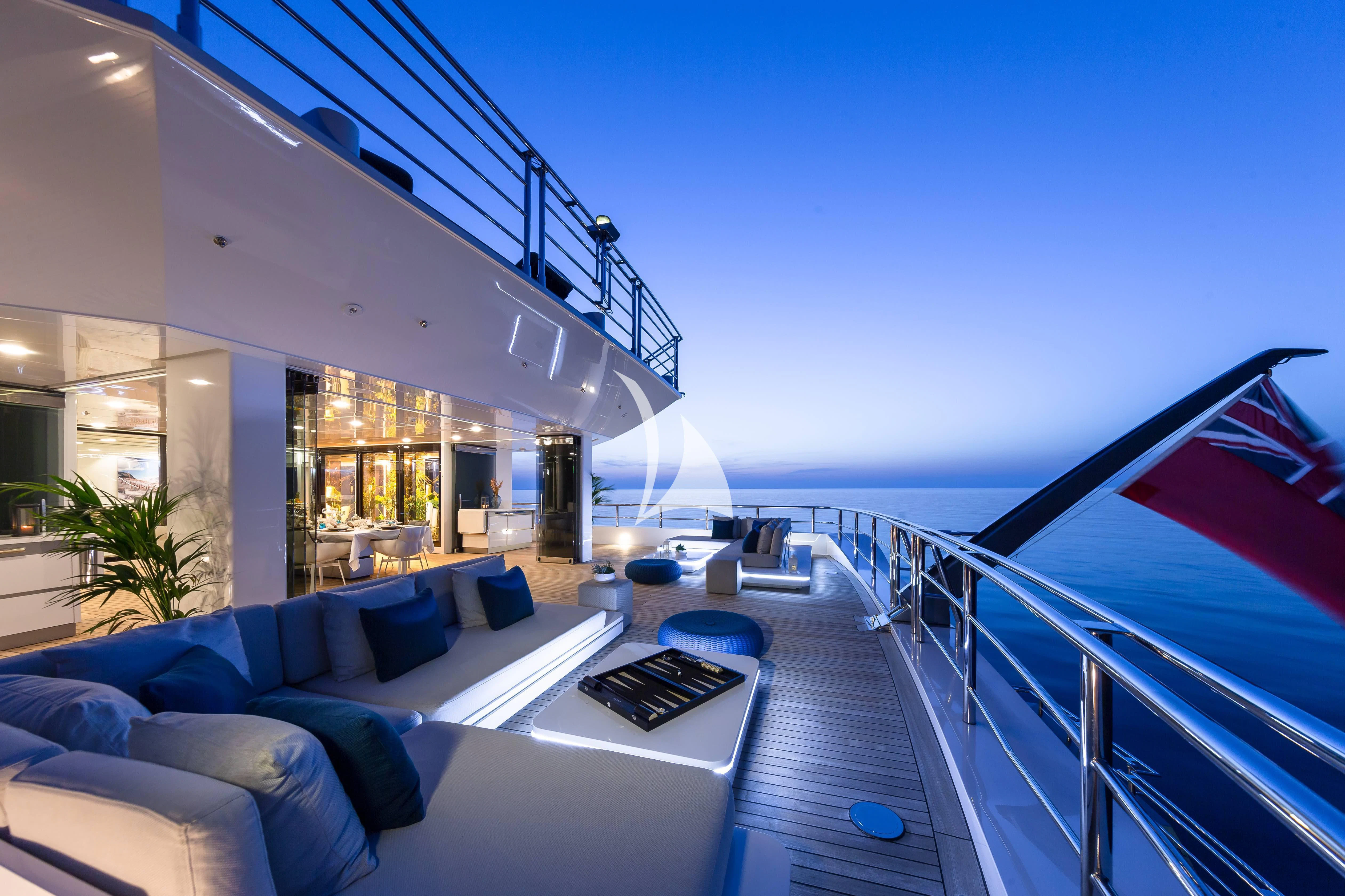 a large balcony overlooking a pool aboard STELLA MARIS Yacht for Sale