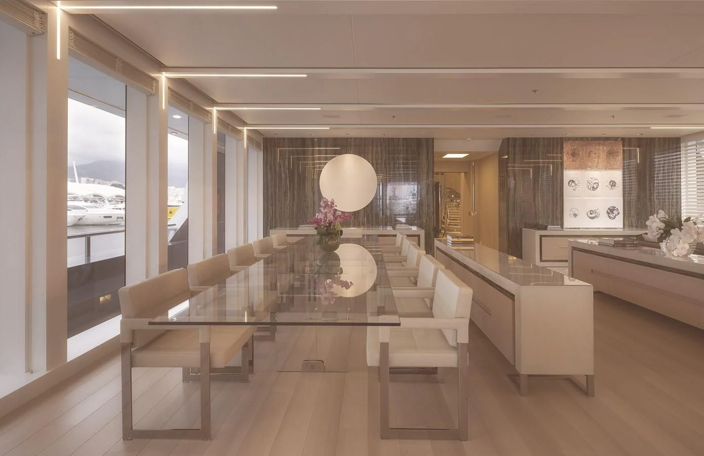 a large room with a large table and chairs aboard STELLA MARIS Yacht for Sale