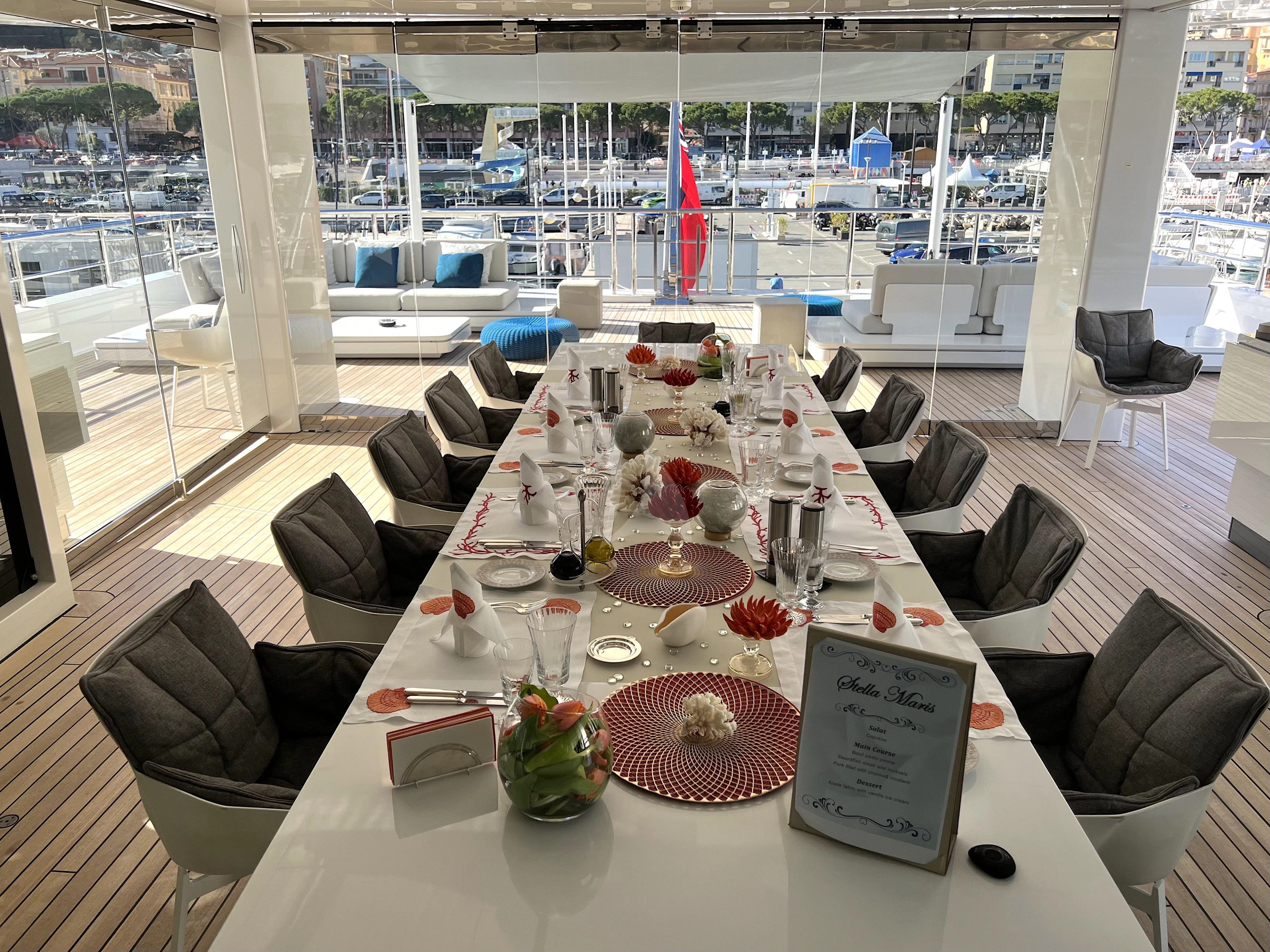 a table with chairs and a table aboard STELLA MARIS Yacht for Sale