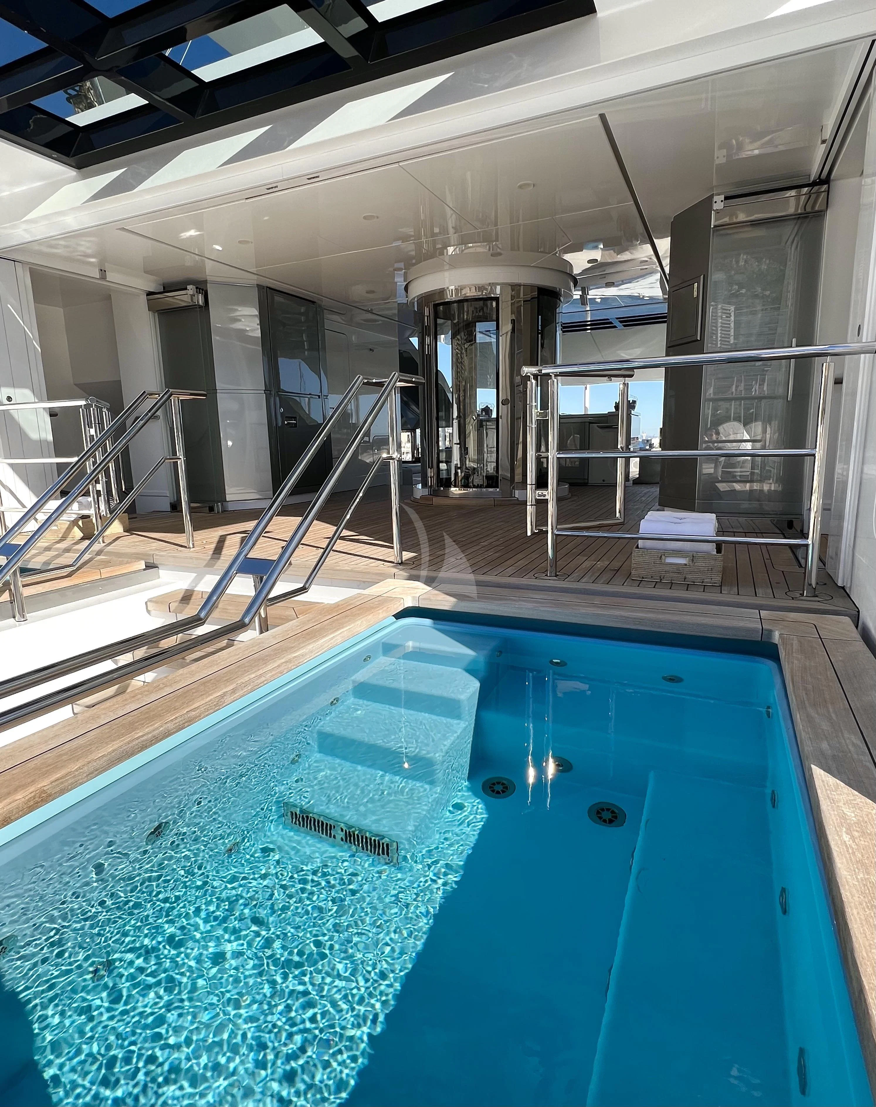 a swimming pool in a building aboard STELLA MARIS Yacht for Sale