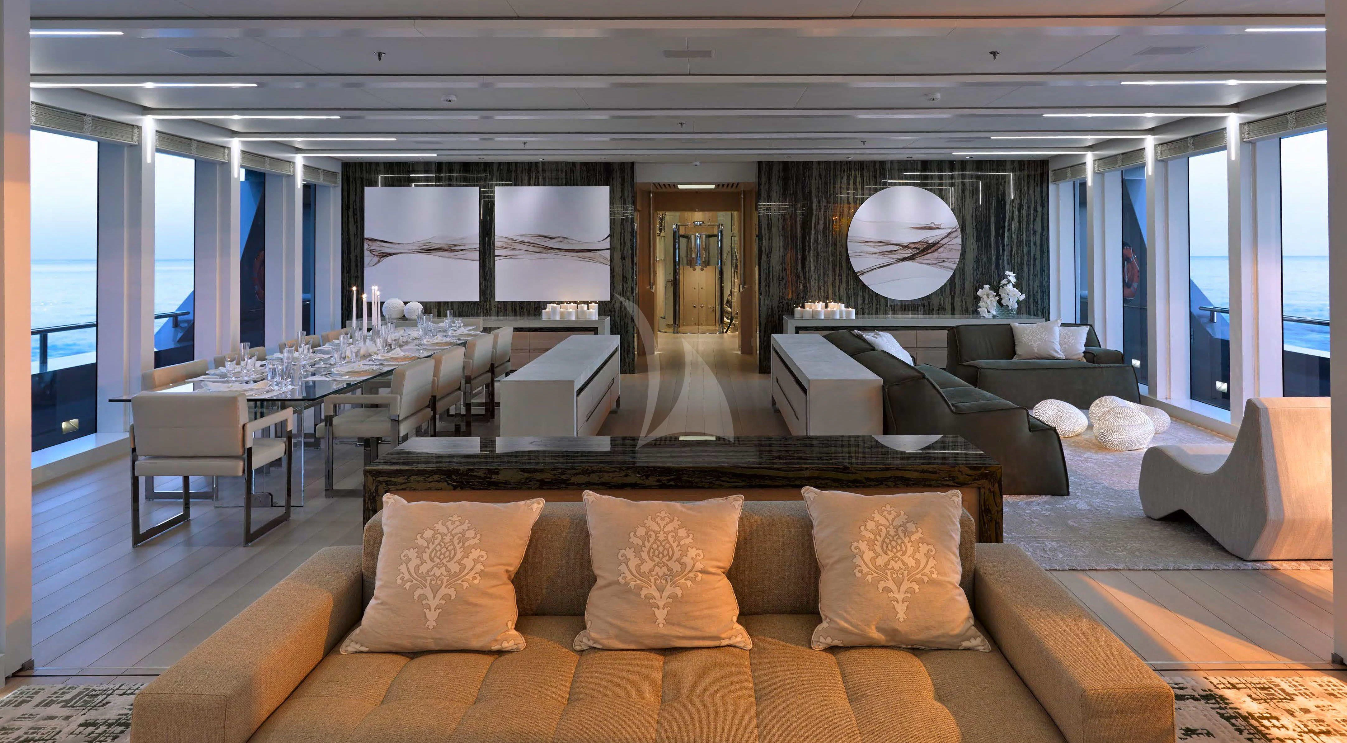 a large room with a couch and a table aboard STELLA MARIS Yacht for Sale