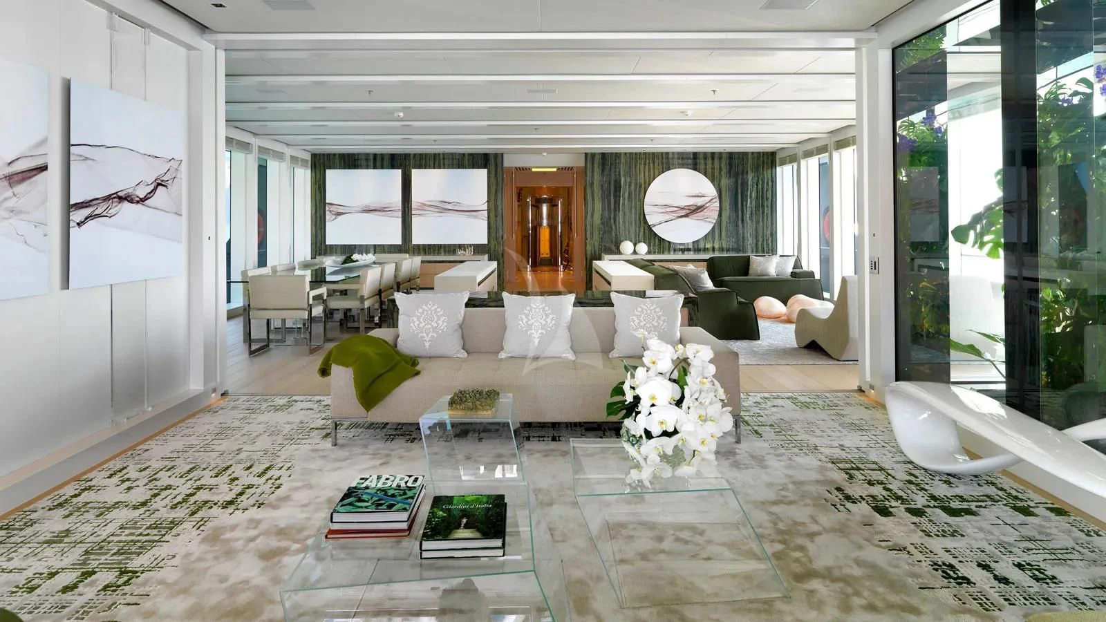 a living room with a couch and a table aboard STELLA MARIS Yacht for Sale