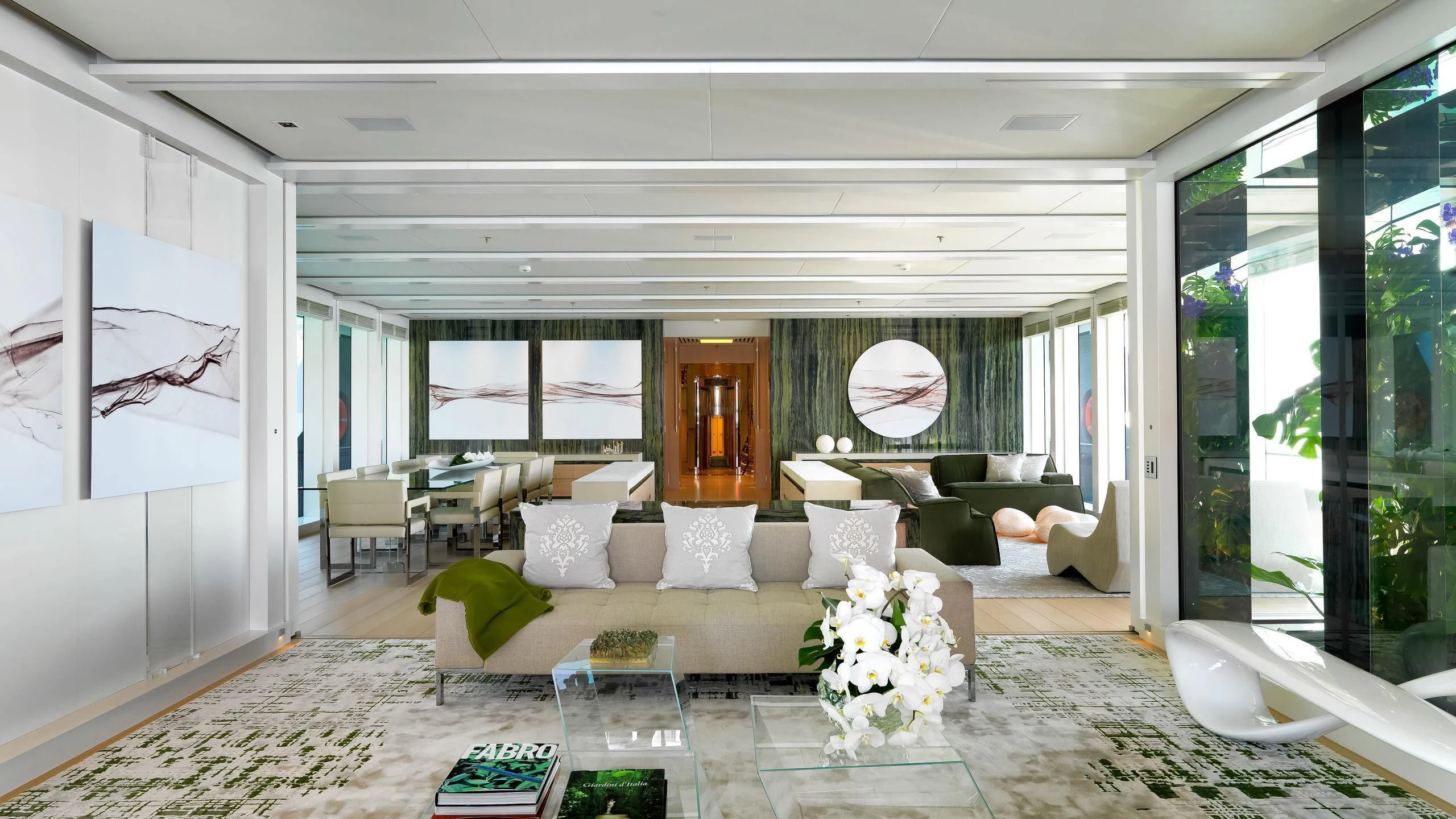 a living room with a large window aboard STELLA MARIS Yacht for Sale