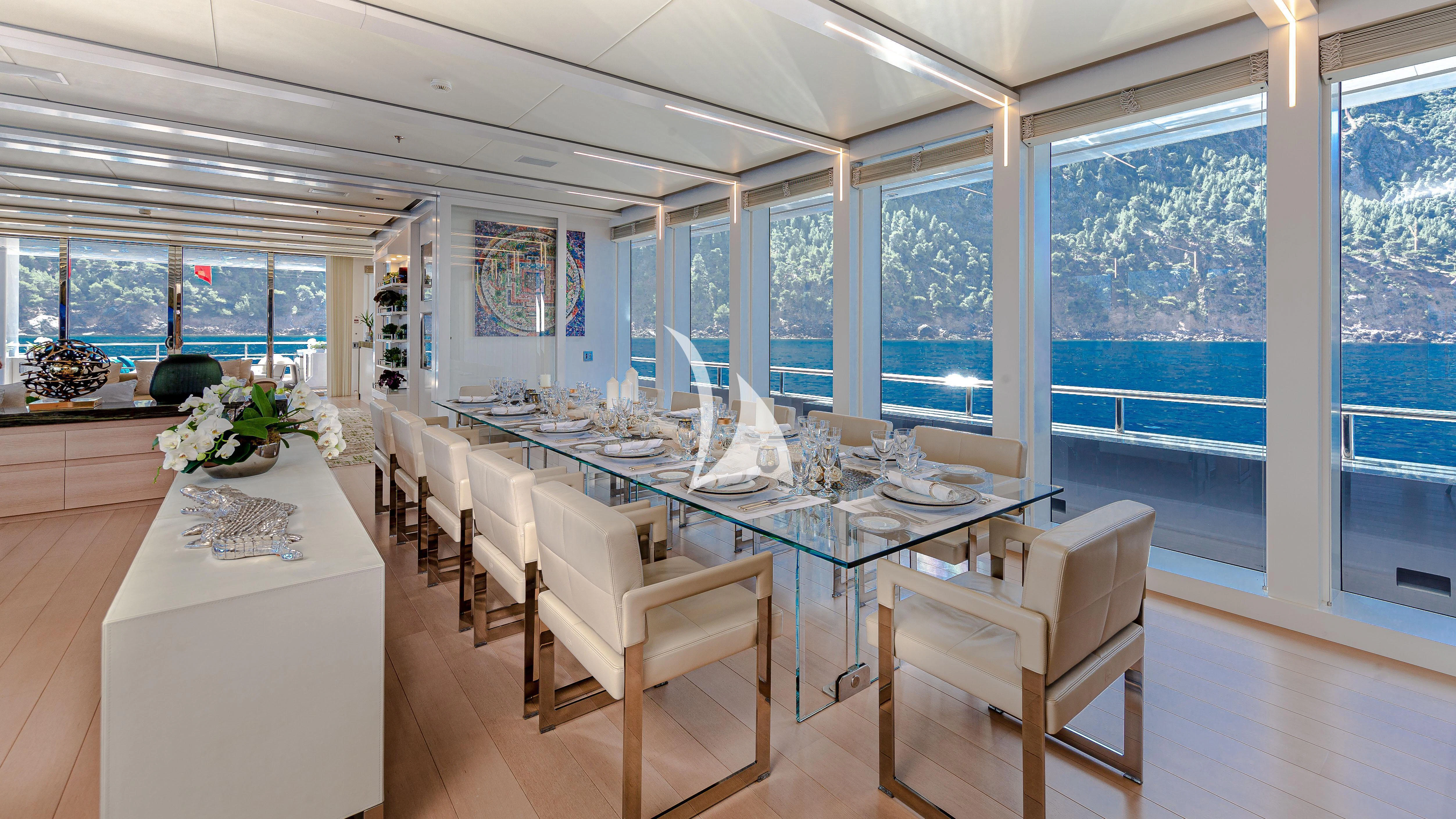 a dining room with a large table aboard STELLA MARIS Yacht for Sale