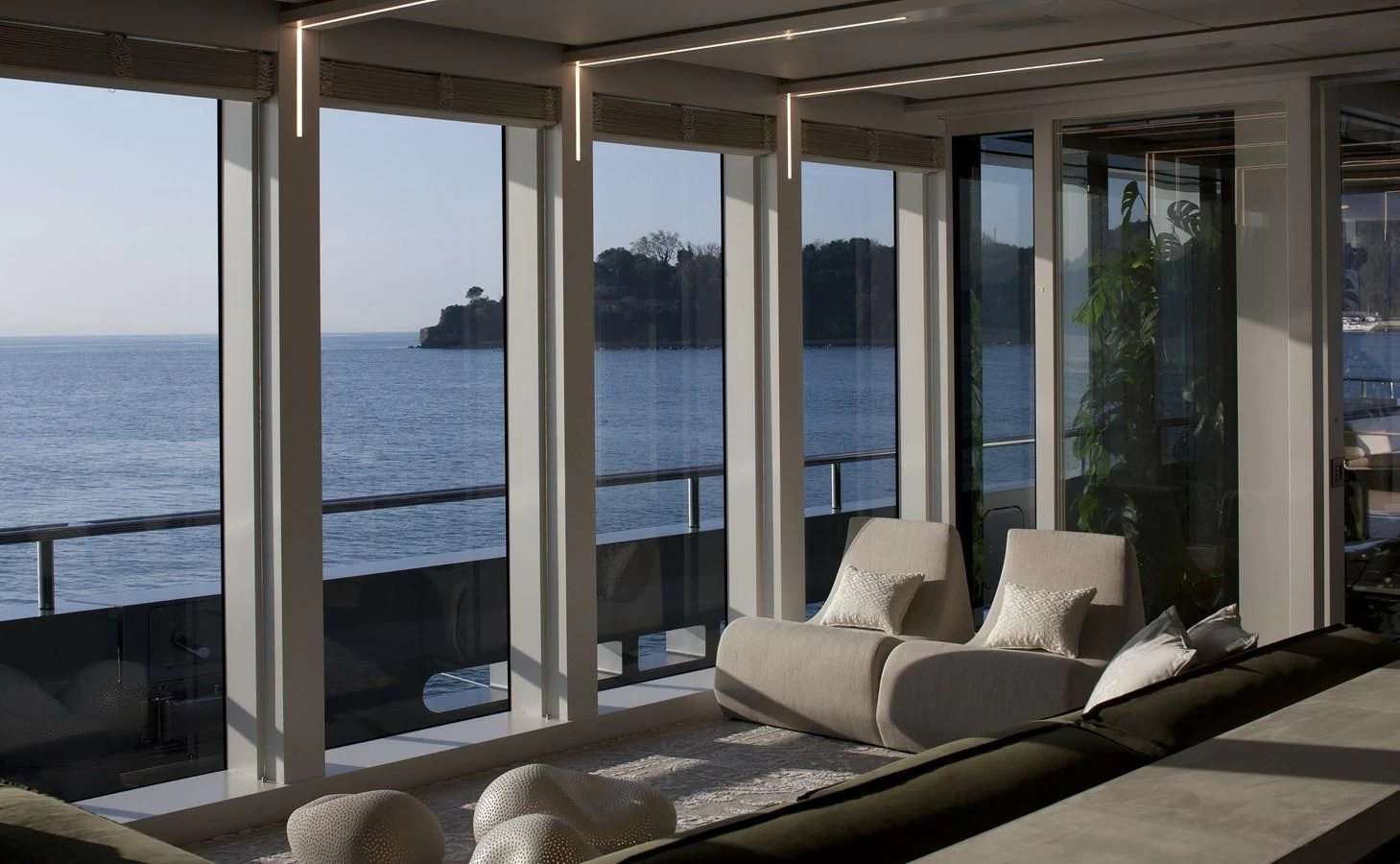 a room with a large window and a view of the ocean aboard STELLA MARIS Yacht for Sale