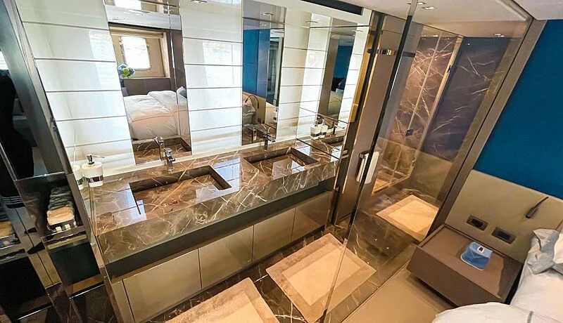 a bathroom with a large mirror aboard THANOON III Yacht for Sale