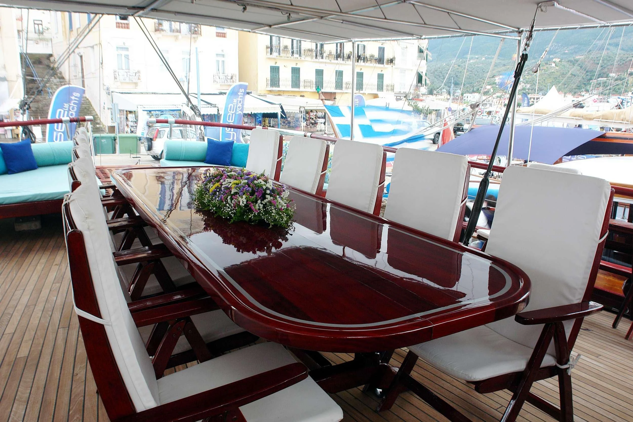 a boat with a flower pot on the deck aboard ERATO Yacht for Charter