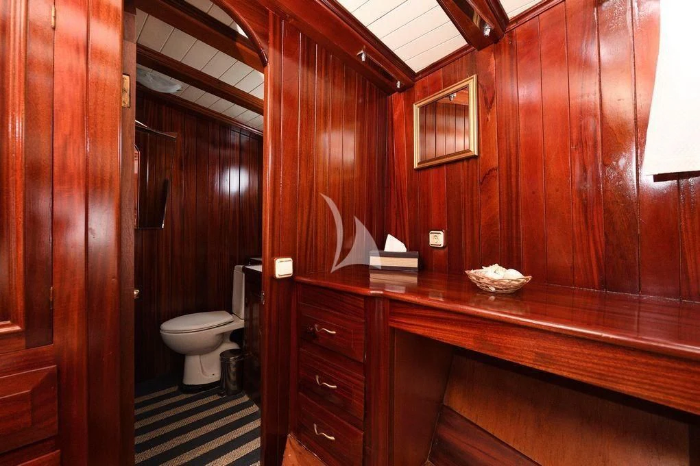 a bathroom with wooden walls aboard ERATO Yacht for Charter
