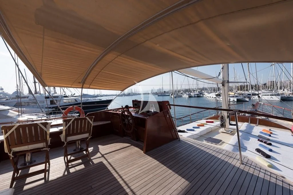 a deck with a view of the water and boats aboard ERATO Yacht for Charter