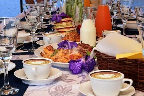 a table with food and drinks aboard ERATO Yacht for Charter