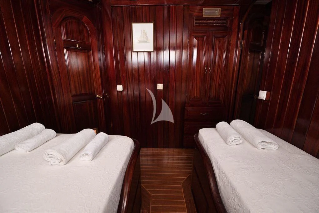 a room with two beds aboard ERATO Yacht for Charter