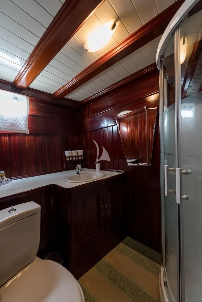 a bathroom with a toilet and sink aboard ERATO Yacht for Charter