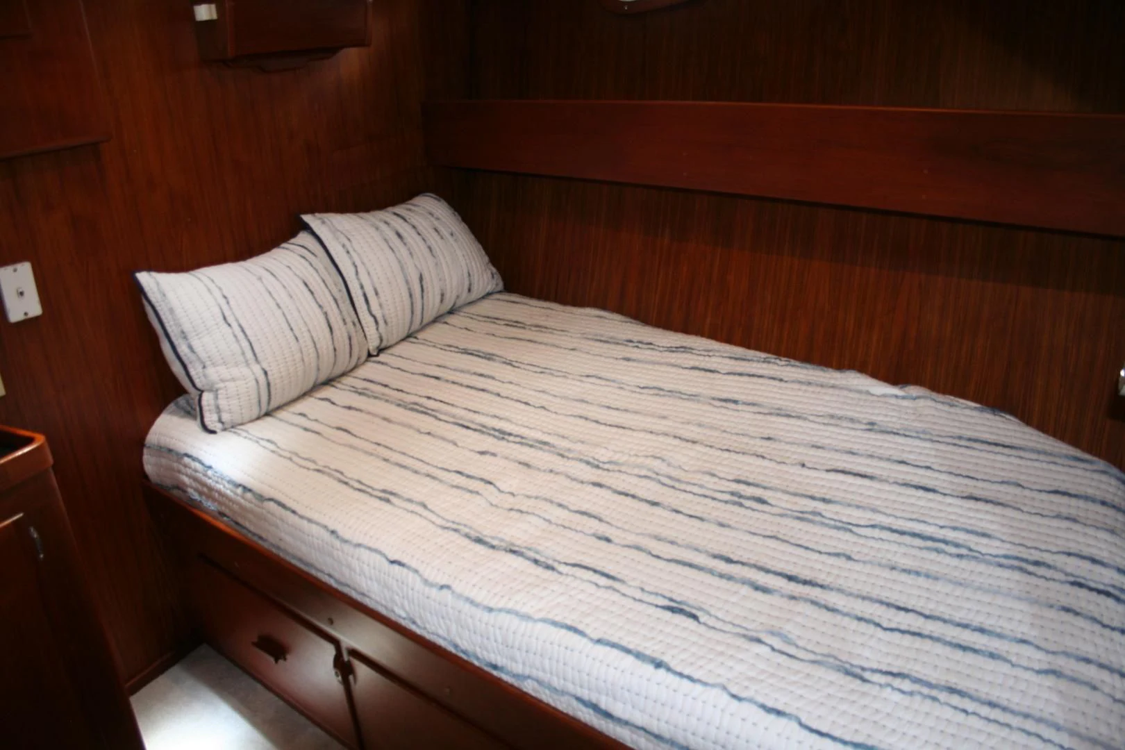 a bed with white sheets aboard SINDBAD Yacht for Sale