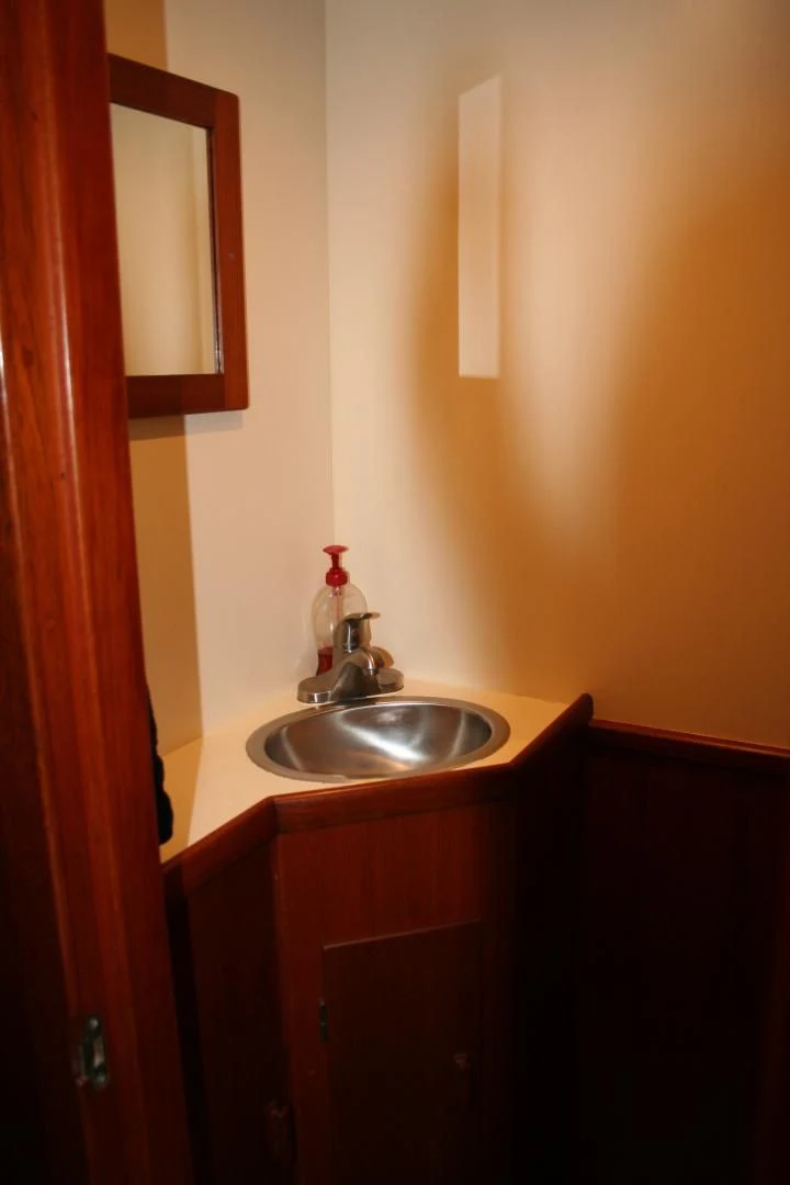 a sink and mirror in a bathroom aboard SINDBAD Yacht for Sale
