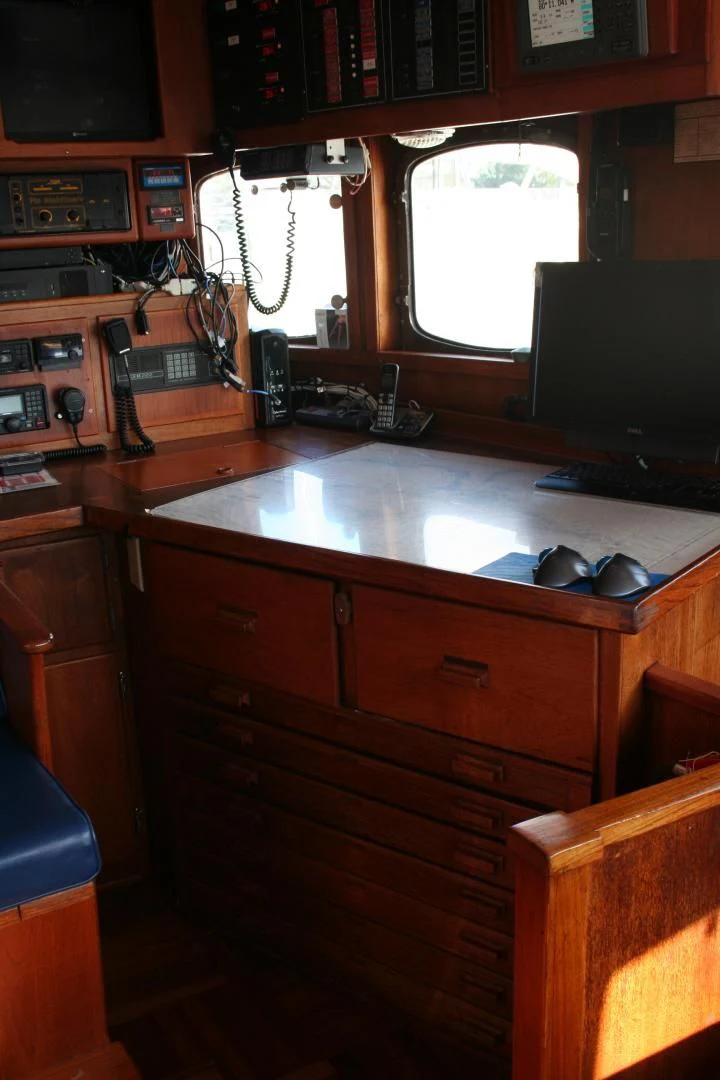 a room with a desk and computer aboard SINDBAD Yacht for Sale