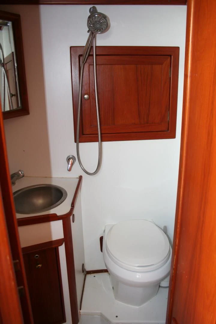 a bathroom with a toilet and sink aboard SINDBAD Yacht for Sale