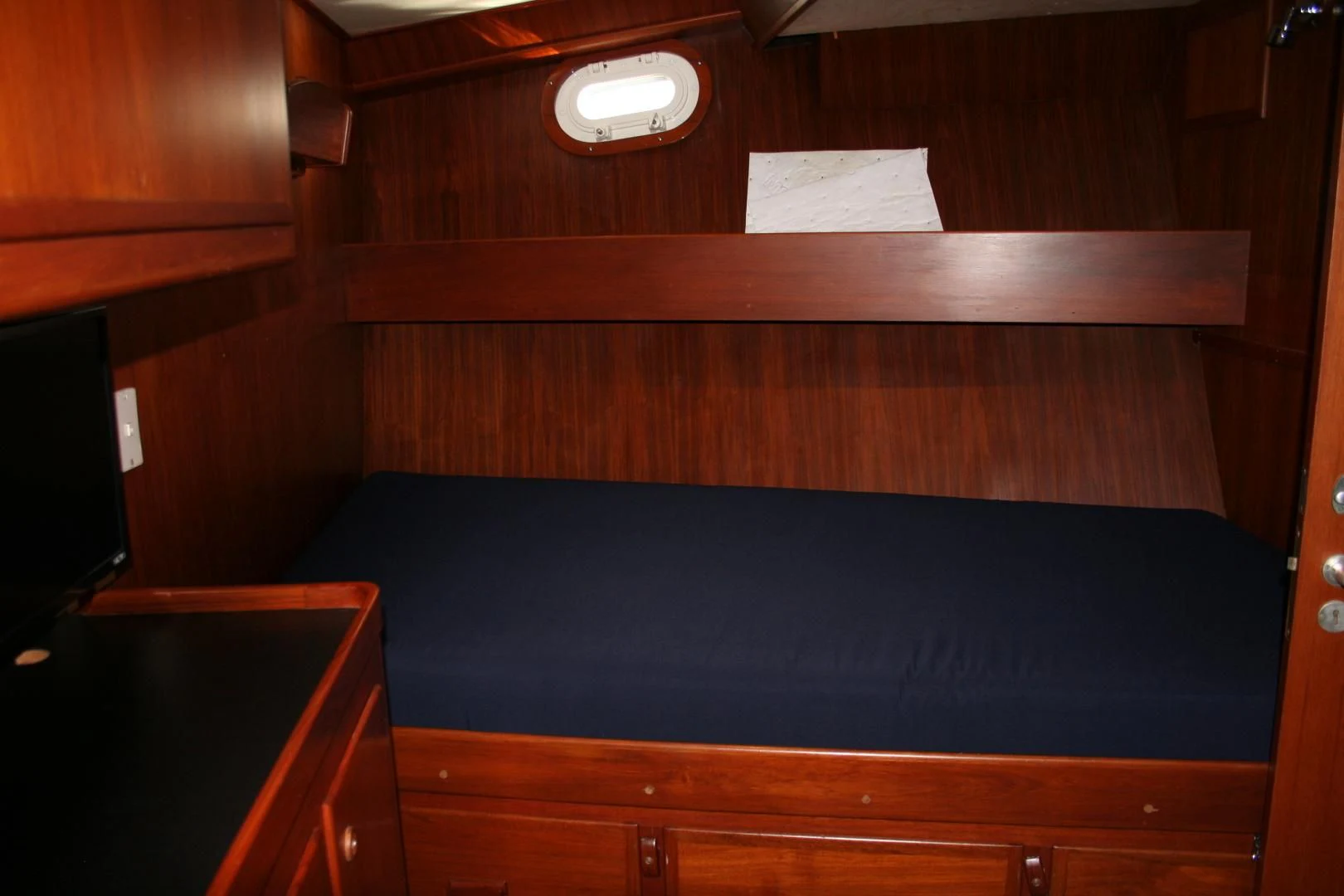 a room with wooden cabinets aboard SINDBAD Yacht for Sale